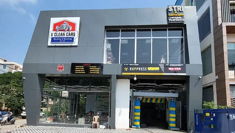 Mockup of the primary service center signage and branded vehicle wrap, demonstrating the identity's high-visibility application in physical space.